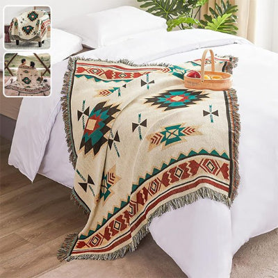 couverture azteque bohemienne vert sur lit