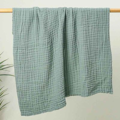 couverture verte etendue sechage