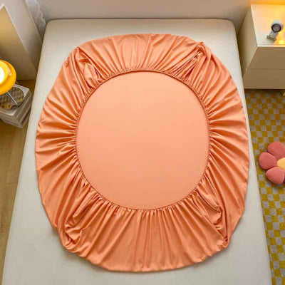 draps housse orange sur lit envers