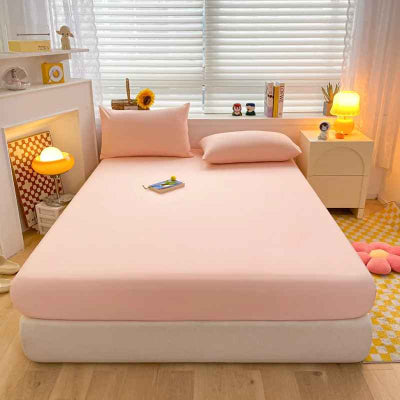 draps housse rose sur lit