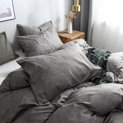 gros plan housse de couette grise sur lit