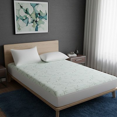housse de matelas bambou vert pale sur lit