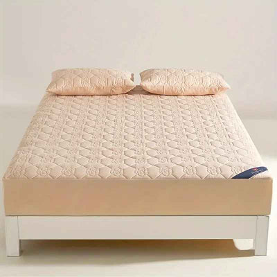 protege matelas beige sur lit