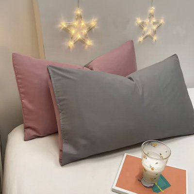 taie d'oreiller rose et gris